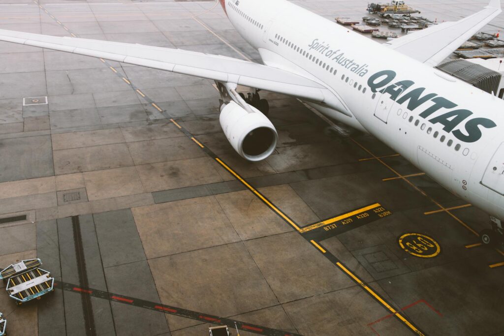 Qantas commercial airplane parked on the tarmac at Melbourne Airport, Australia.